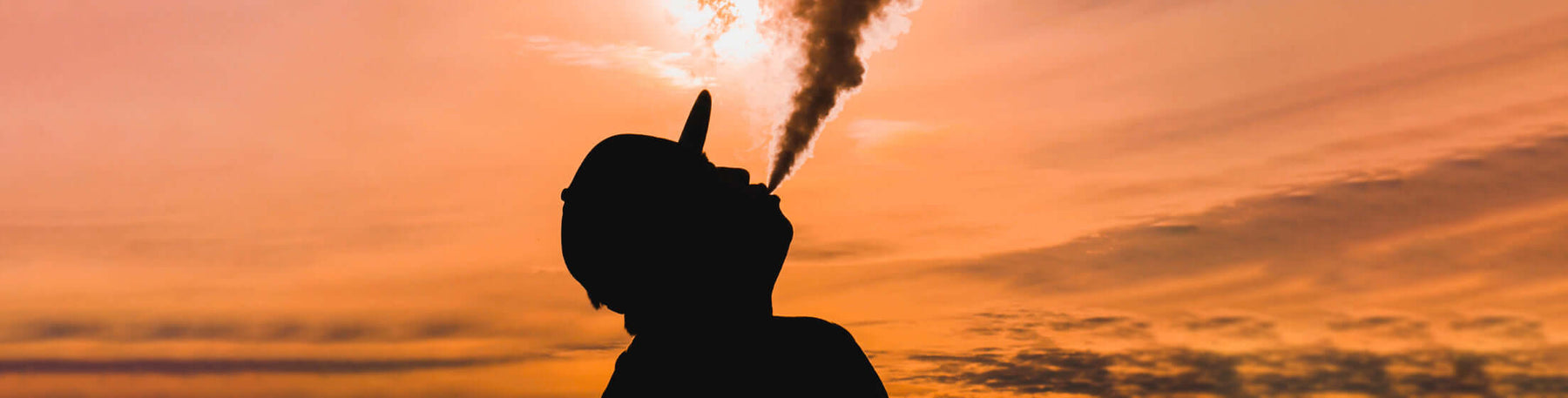 silhouette of man vaping 