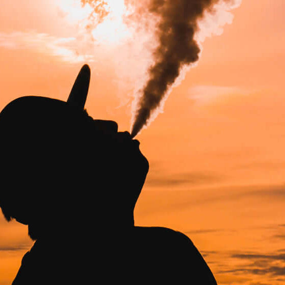 silhouette of man vaping 